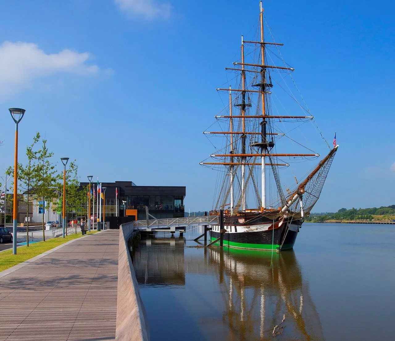 The Dunbrody Famine Ship: a three-masted tall ship moored at the quayside in New Ross.